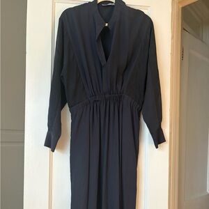 Elegant Vince Navy Midi Dress.  Sz Large.
Tiny hole as seen in picture.